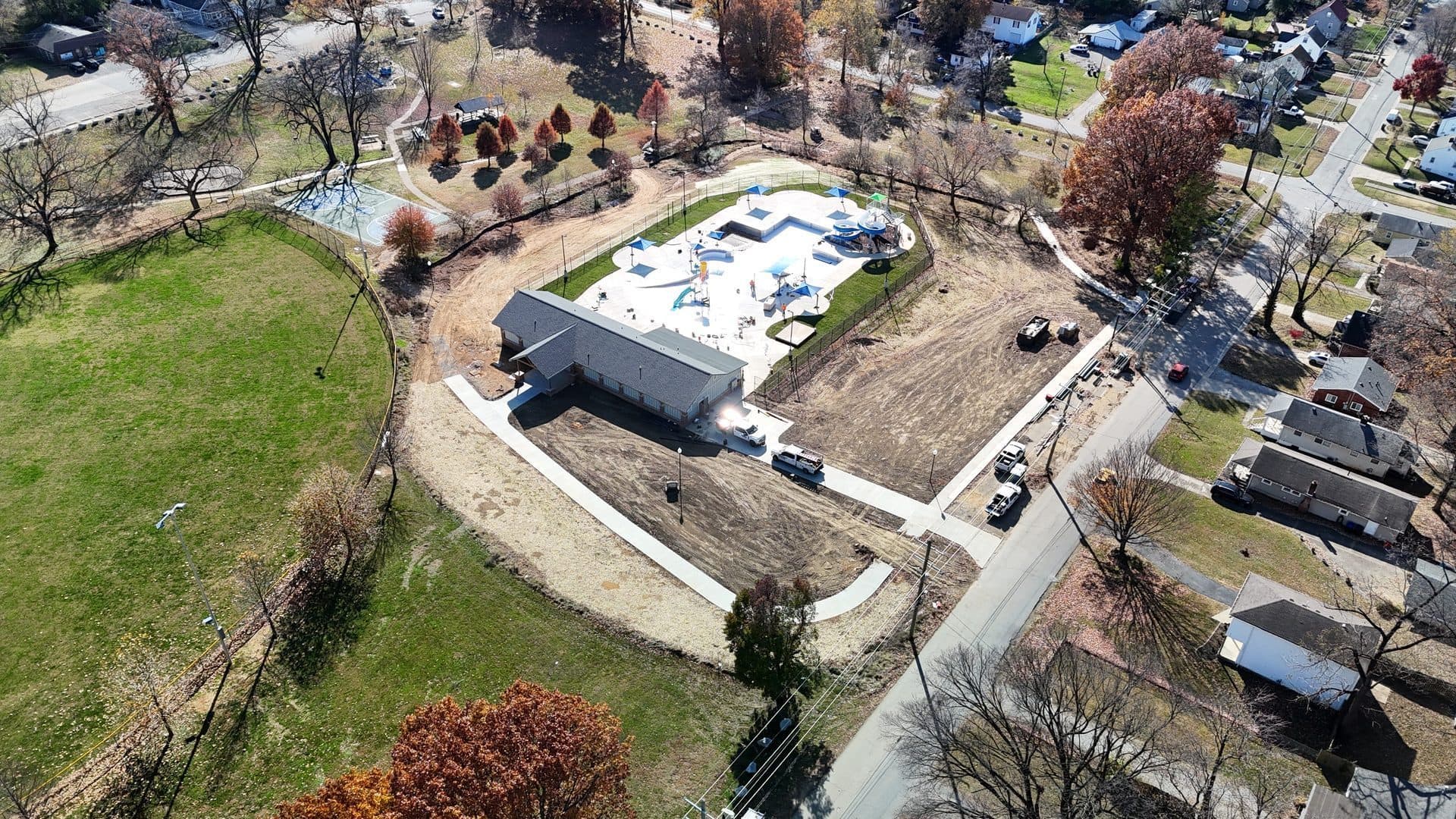 Aerial of the Camp Taylor waterpark and pool house beside the surrounding park