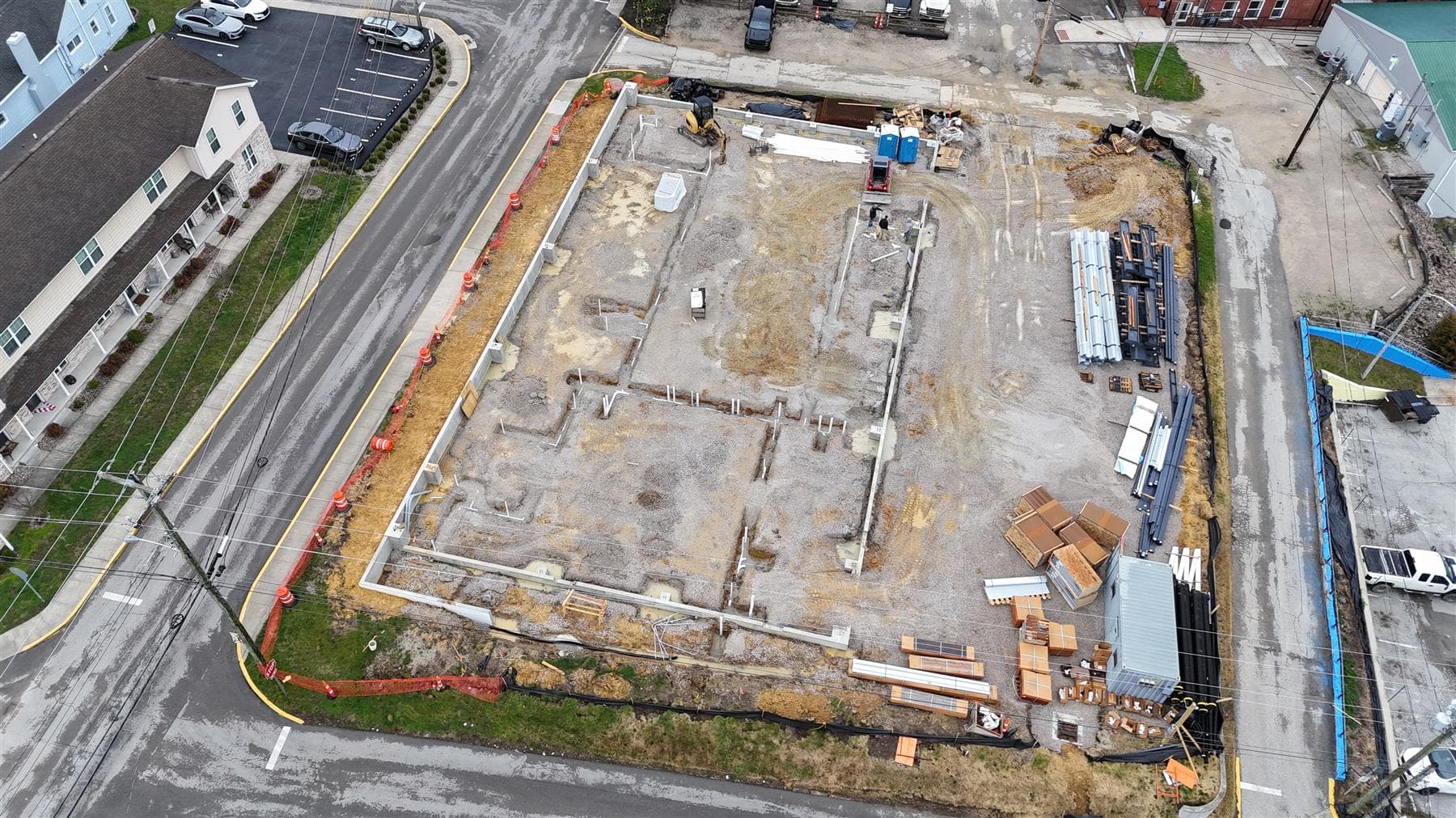 Closer aerial of the steel frame and concrete slab, March 2026