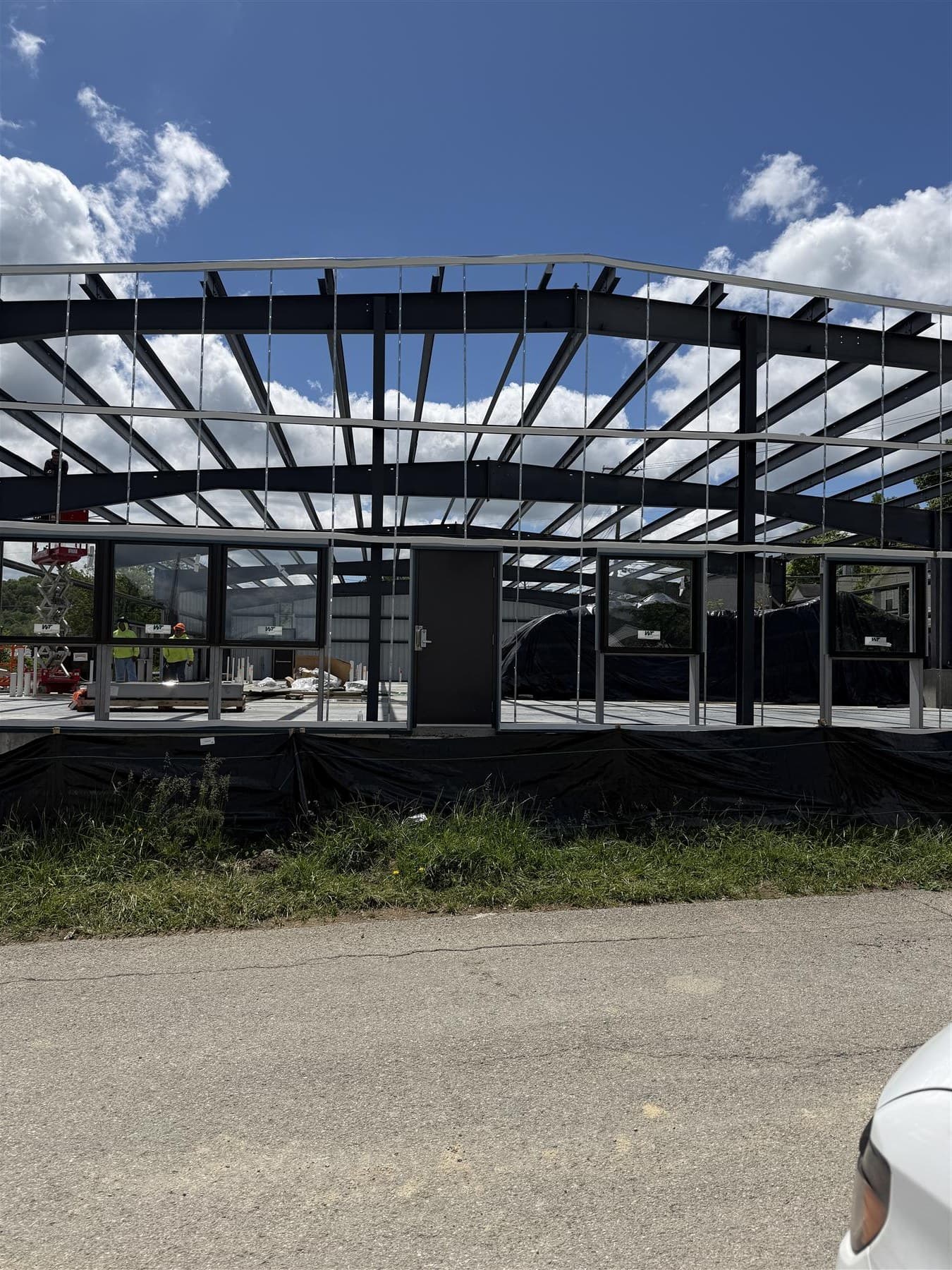 Roof panels on the pre-engineered metal building, April 2026