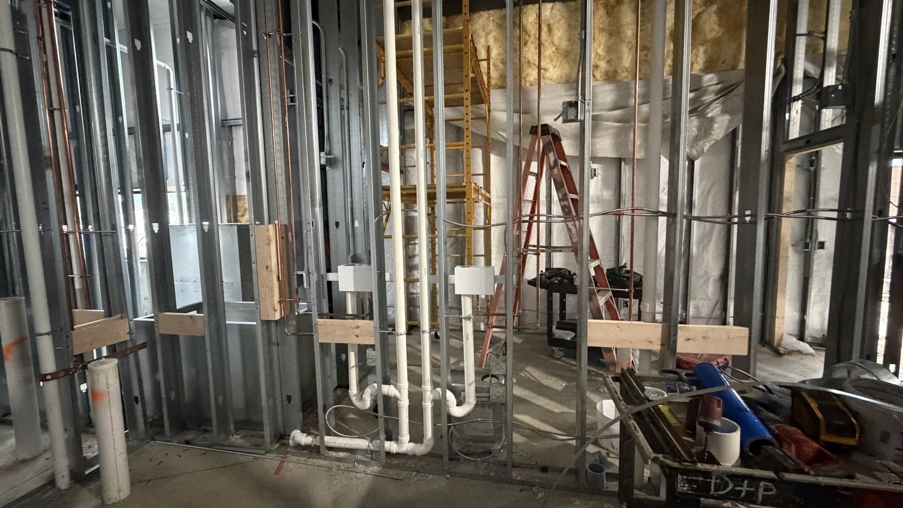 Overhead ductwork and electrical rough-in, June 2026